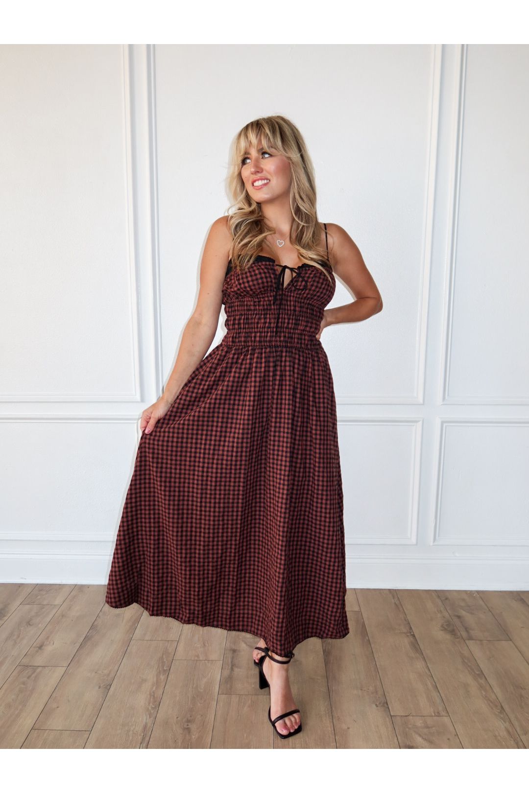 The Thomas Dress is a red and black checkered maxi dress for women—perfect for fall outfits, holiday parties, casual style, and trendy boutique fashion.