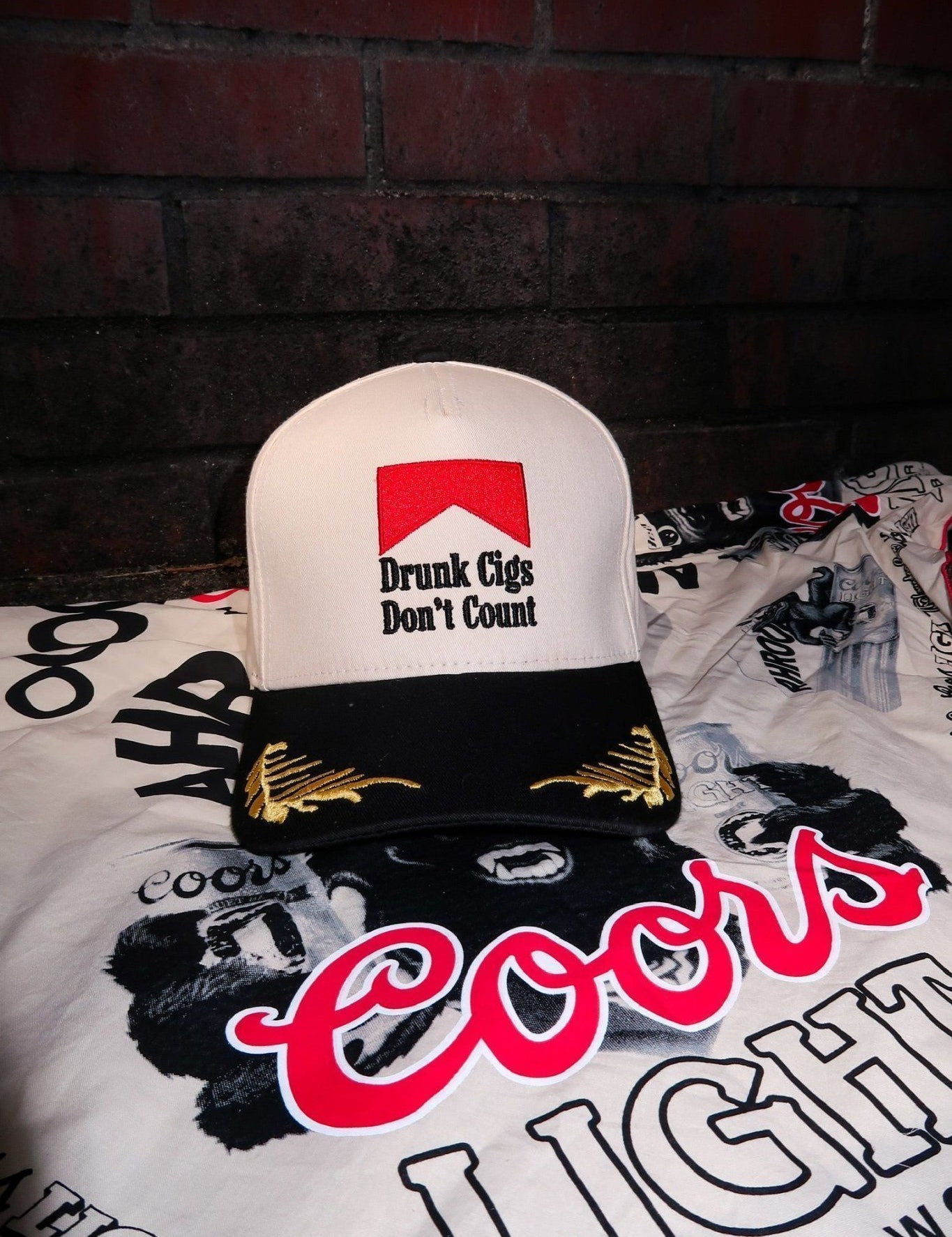 The Drunk Cigs Trucker Hat is a trendy embroidered women’s trucker hat—perfect for casual streetwear, going out looks, and edgy boutique accessories.