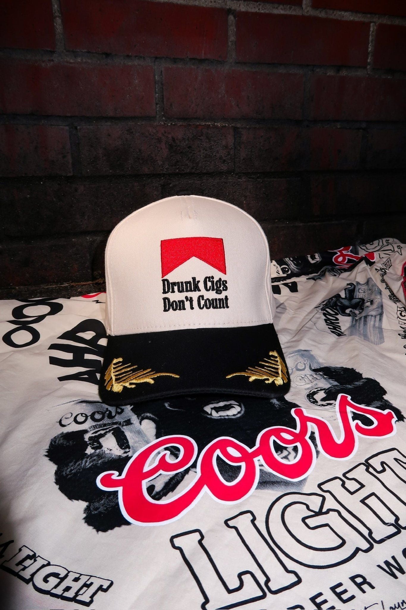 The Drunk Cigs Trucker Hat is a trendy embroidered women’s trucker hat—perfect for casual streetwear, going out looks, and edgy boutique accessories.