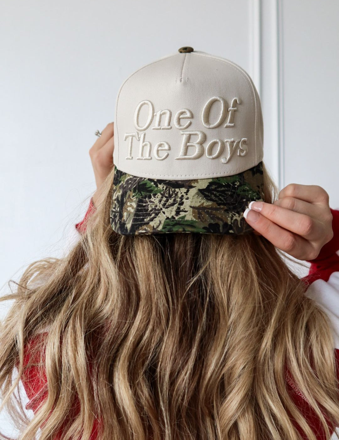 The One of the Boys Trucker Hat is a trendy embroidered women’s trucker hat—perfect for casual outfits, streetwear style, game day, and boutique fashion.