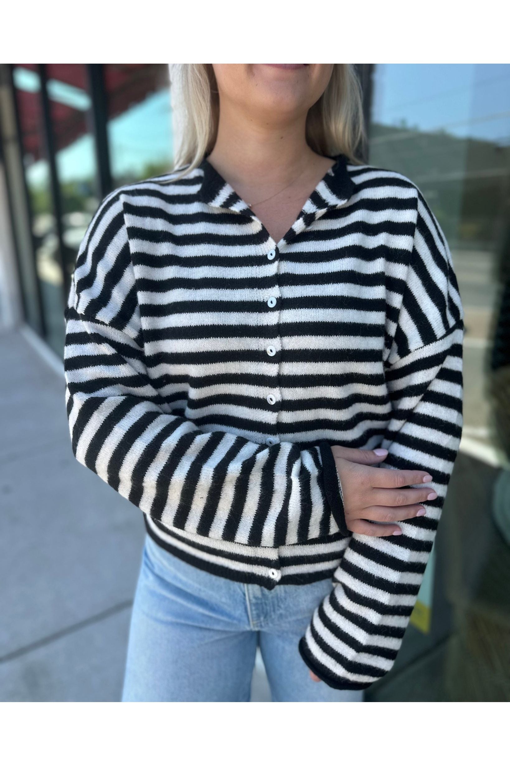 The Piper Cardigan is a viral lightweight women’s cardigan in black and white stripes—perfect for layering, fall outfits, and trendy boutique fashion.